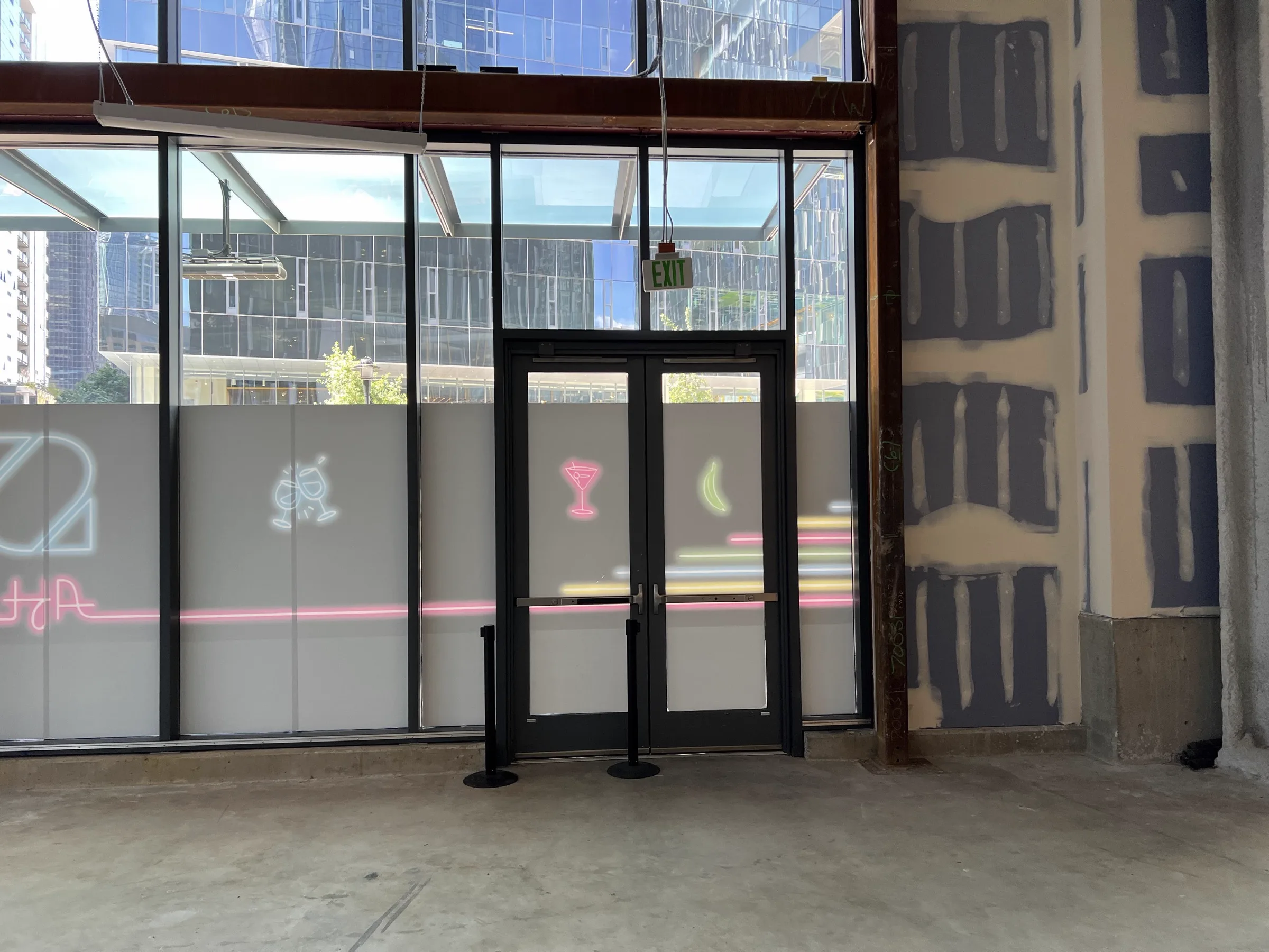 Studio entrance with neon decals on glass