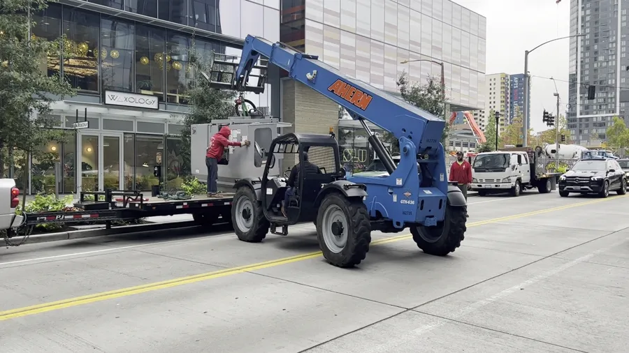 Haas TM1P CNC mill being delivered by forklift on the South Lake Union sidewalk